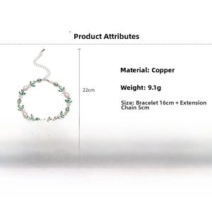 Detail of silver leaf bracelet showing green marquise gems and copper base specifications