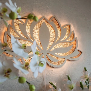 Wooden mandala yoga night light with lotus pattern and warm LED backlight on wall