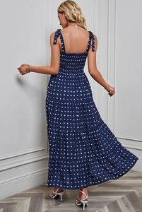 Detail of blue floral maxi dress featuring tie-up straps and elastic smocked back