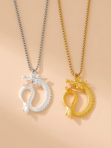 Detailed view of the intricate dragon pendant necklaces in gold and silver finishes