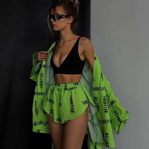 Street style view of neon green lounge set featuring loose shirt and high waist shorts