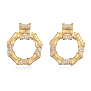Elegant gold plated bamboo hoop earrings featuring sparkling pave-set cubic zirconia crystals