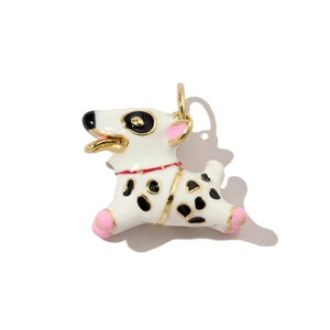 Macro view of cartoon spotted dog charm with white enamel and golden metal borders