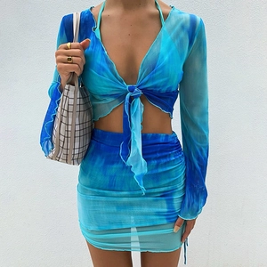 Detailed view of tie-dye mesh fabric with V-neck lace-up and ruched skirt textures