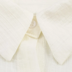 Minimalist white textured blouse with classic pointed collar and linen fabric detail