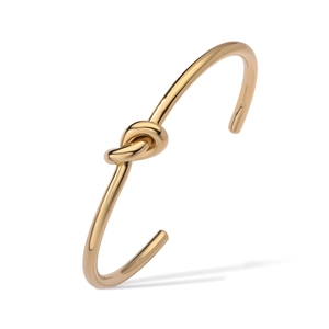 Bracelet jonc ouvert en acier inoxydable plaqué or 18 carats avec un design de nœud poli
