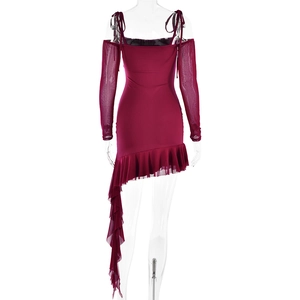 Detail view of burgundy off-shoulder dress featuring mesh long sleeves and asymmetric ruffled hem