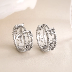 Minimalist silver star cutout earrings with 18K gold plating and bead edge detail