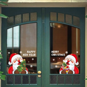 Detail of Santa Claus window stickers with snowflake patterns on glass doors