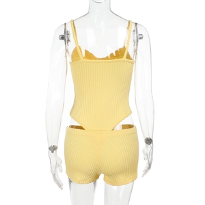 Rear view of bright yellow ribbed knit two-piece set featuring camisole and bodycon shorts