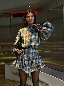 Elegant women's plaid two-piece set featuring long-sleeved shirt and ruffled mini skirt