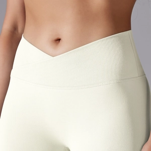Close-up of seamless high waist yoga pants with V-cross waistband and ribbed texture