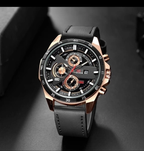 Detail of chronograph sub-dials and date window on rose gold quartz watch face