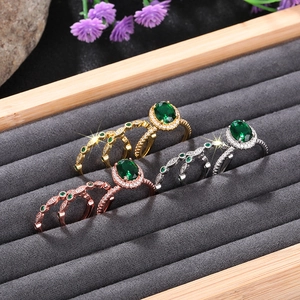 Macro detail of luxury halo oval green gemstone ring sets in three plating finishes