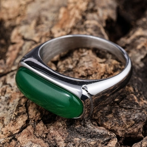 Vintage stainless steel ring featuring a polished oval green cat eye gemstone setting