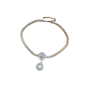 Gold plated necklace with luxury baguette crystals and a large white pearl drop pendant