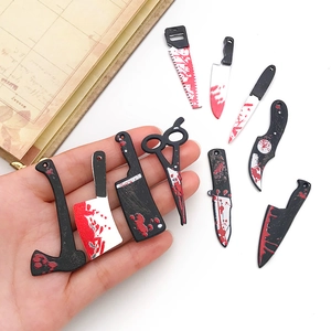 Set of 9 acrylic bloody weapon charms including saws and knives for DIY Halloween jewelry