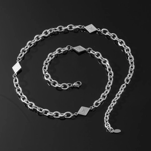 Titanium steel clavicle chain with star diamond plaque on reflective black background