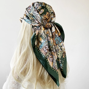 Detailed back view of a 90cm satin scarf with abstract cat and face prints on a model
