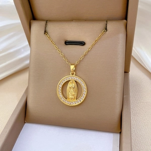Detail of gold-plated Virgin of Guadalupe pendant with sparkling pave zircon frame