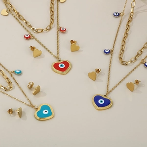 Golden stainless steel layered necklace and heart evil eye earring set in red and blue