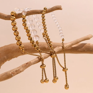 Detailed shot of adjustable 18K gold-plated beaded bracelets with crystal elements
