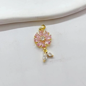 Elegant gold flower pendant with pink pear-cut gemstones and sparkling leaf charms