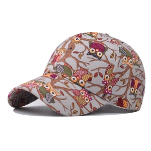 Detailed side view of grey cotton baseball cap with colorful owl and branch print