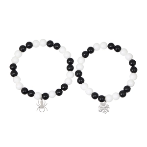 Couples spider and web beaded bracelets set in black and white with silver charms