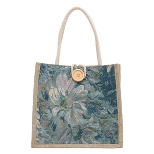 Japanese style linen floral handbag with woven rope handles and a large wooden button