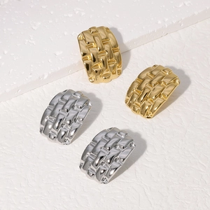 Textured 18k gold and silver rectangular stud earrings with woven metallic patterns