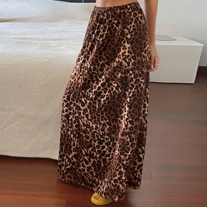 Close-up of high-waist elastic band and leopard print fabric on a long skirt