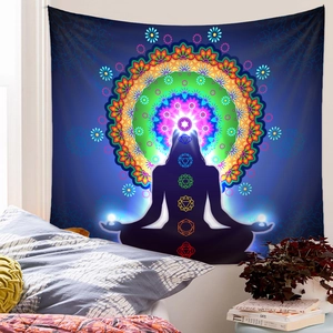 Detail view of meditation tapestry with colorful chakra symbols and mandala in a bedroom