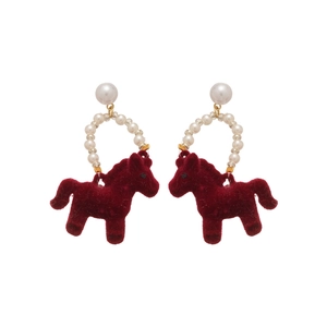 Elegant red flocked horse stud earrings with cream pearls and gold accents on white background