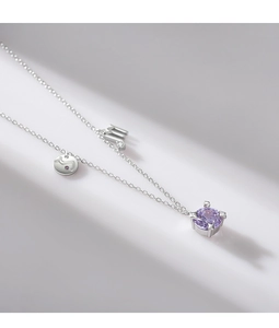 Detail of S925 silver necklace with Scorpio zodiac charm and purple gemstone pendant