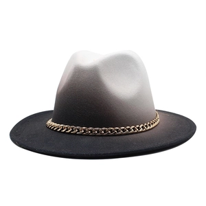 Close-up of a gradient wool fedora hat featuring a chunky gold chain accessory