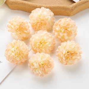 Close-up of champagne silk artificial pompon flowers for DIY wedding and hat decorations