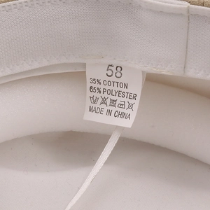 Detailed close-up of inner hat label showing 35% cotton, 65% polyester and size 58