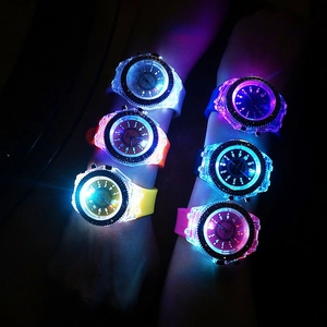 Close-up of LED glowing watches with colorful silicone straps in various light-up colors