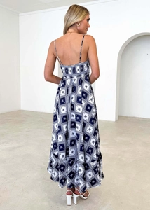 Detail of bohemian long dress back view with blue floral print and cross straps