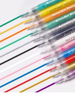 Macro shot of colorful acrylic paint pens showing vibrant ink flow and line coverage