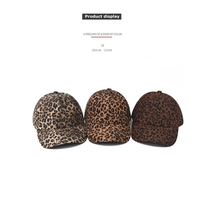 Detailed view of classic leopard print baseball caps in light and dark brown suede fabric