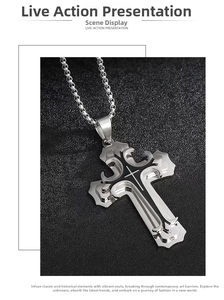 Macro detail of a layered stainless steel cross pendant with black enamel finish and chain