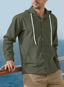 Detail of army green cotton linen hooded shirt with white drawstring and brown buttons