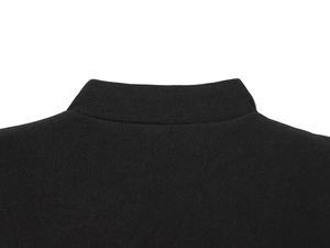 Detailed view of the structured black lapel collar and woven texture on this slim blazer