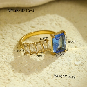 Detailed view of adjustable gold titanium ring with blue zircon and size specifications