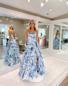 Detail of blue floral print corset dress with tiered organza ruffles and high side slit