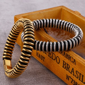 Detailed view of industrial style men's spiral texture bracelets with metal and rubber
