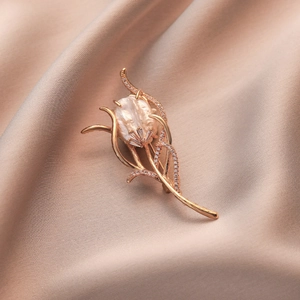 Elegant rose gold tulip brooch with baroque pearl and shimmering cubic zirconia floral pin