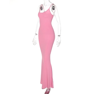 Side view of a pink bodycon maxi dress with spaghetti straps and mermaid hem on a mannequin